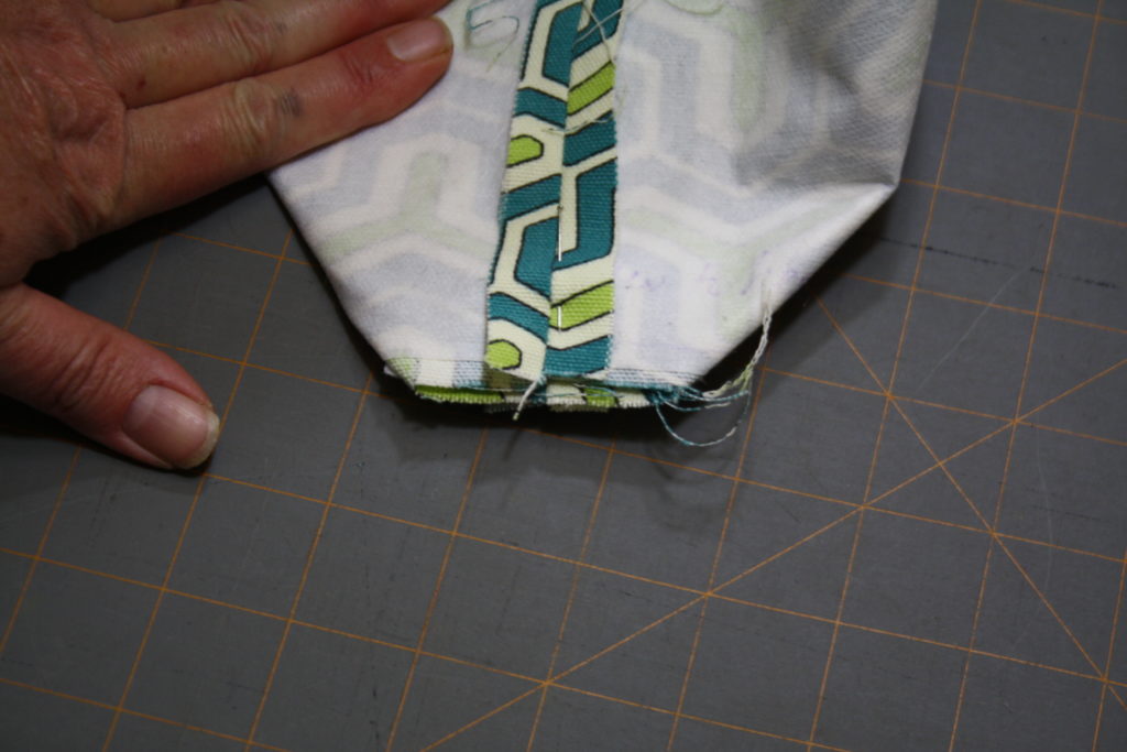 refold corner and sew across